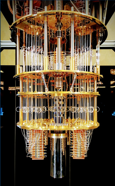 A gold-toned quantum computer with its intricate wiring and cooling structure